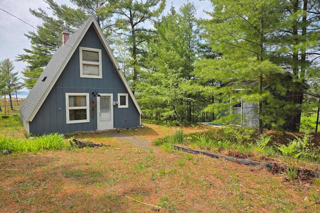 Rustic A-Frame Retreat on Grand Traverse Bay with beach, wifi, fire pit & grill