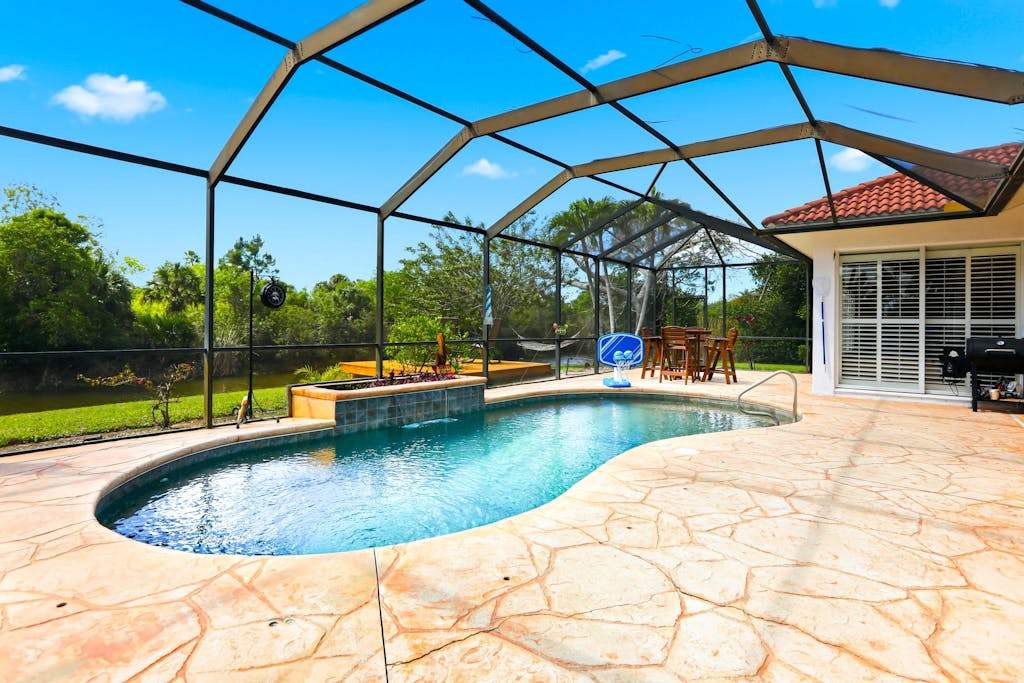 Waterfront home with private heated pool dock firepit grill bikes fireplace
