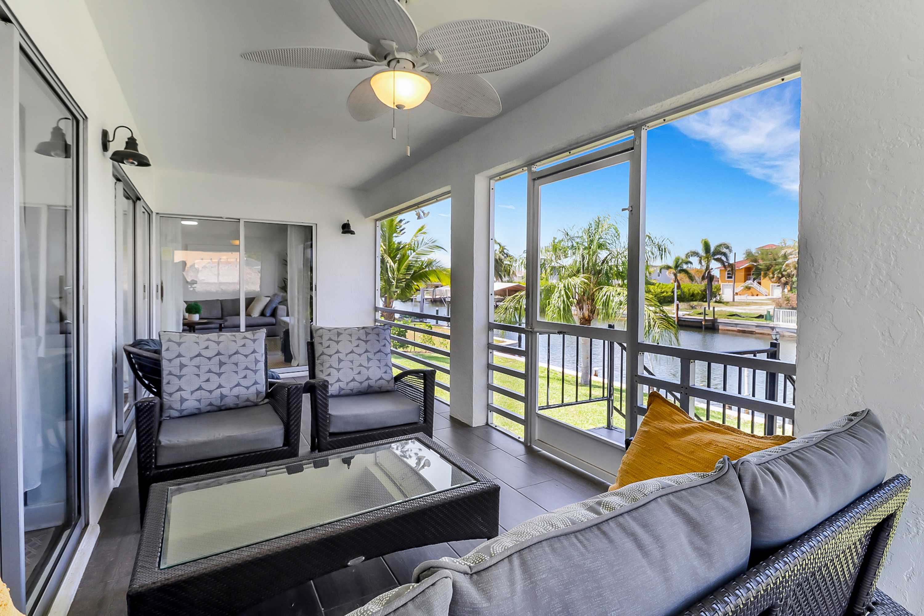 Serene & sunlit waterfront home with dock patio & incredible views near golf