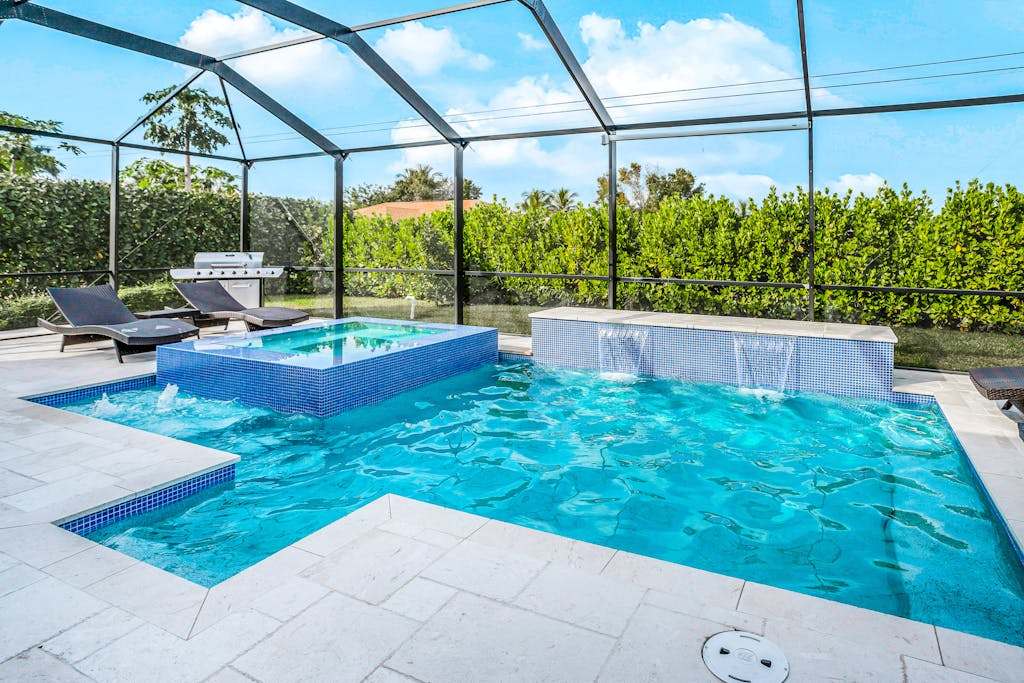 Dog friendly pool home with outdoor kitchen game room, cabana, pool spa 