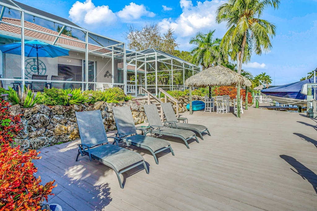 Custom waterfront home with dock heated pool AC & amazing indoor & outdoor spaces