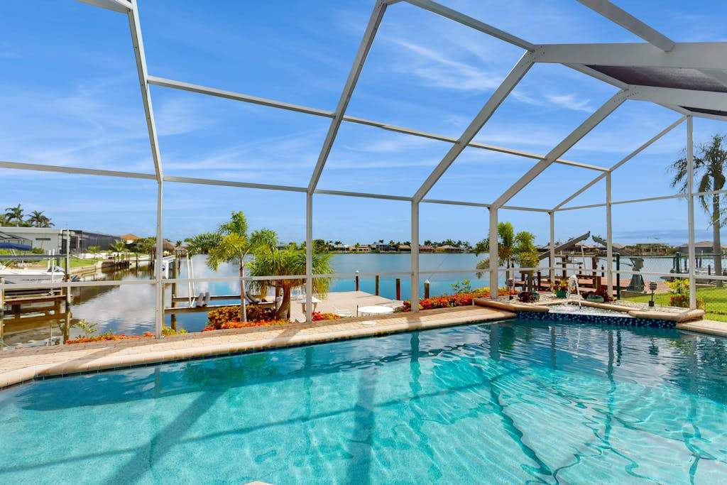 Villa Aasta Luxe Lakefront Outdoor Living with Screened Pool Game Room & Dock
