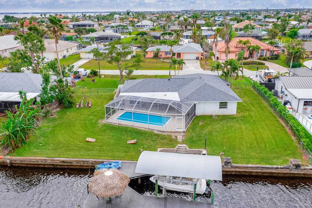 Canal Front Getaway with Private Dock Kayaks Fishing Rods & Heated Pool