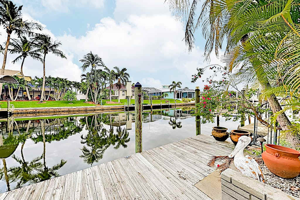 Dog friendly canal front home with a private pool & dock in a prime location