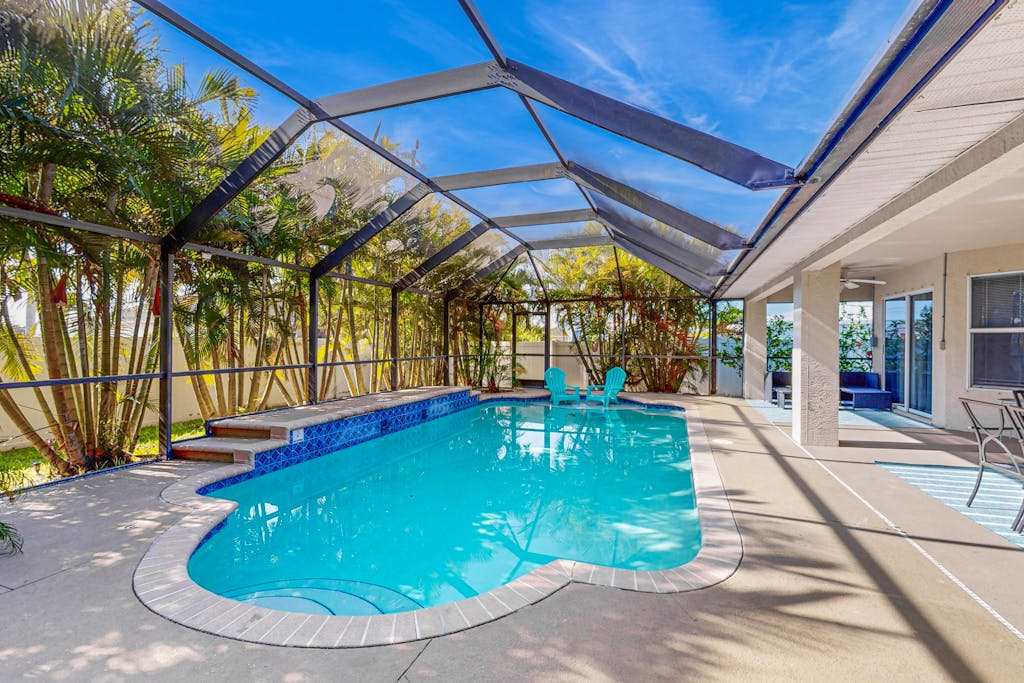 Luxury coastal retreat with office lanai pool alfresco dining & tiki bar