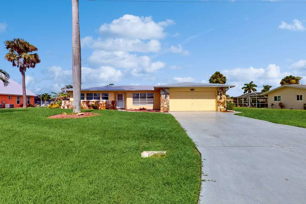 Waterfront home with heated pool dock & kayaks minutes to beach