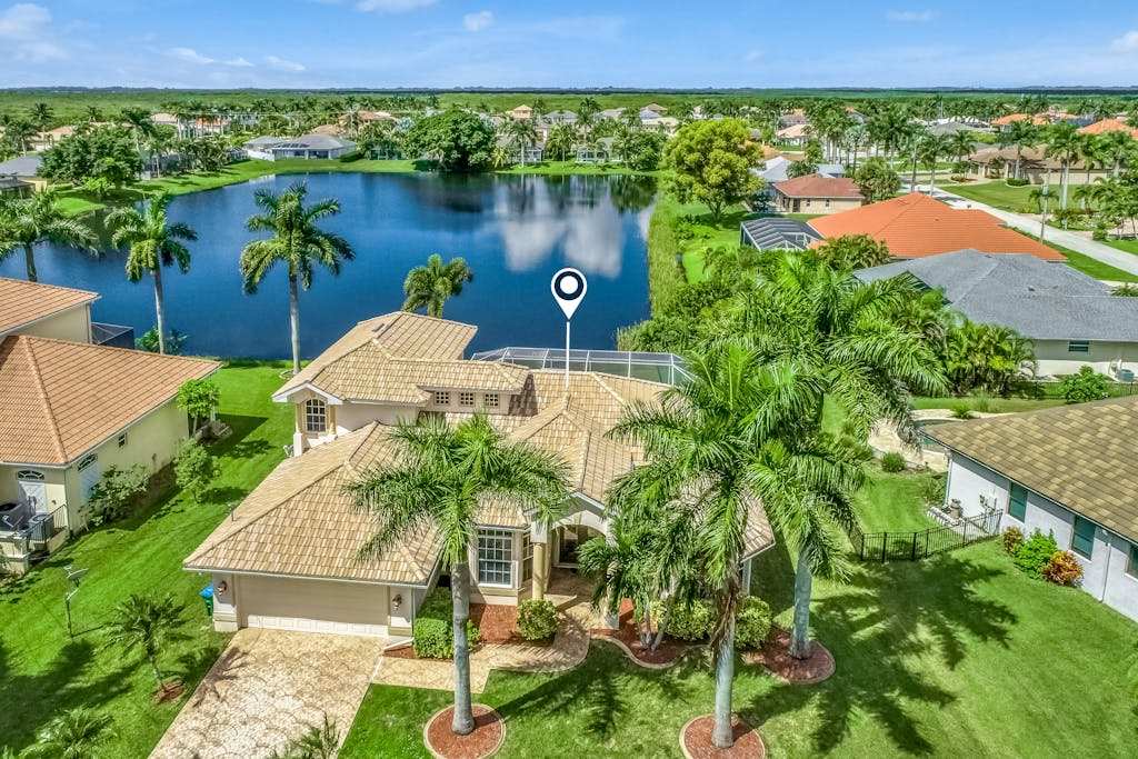 Updated lake view luxury home with private heated pool & jetted tub