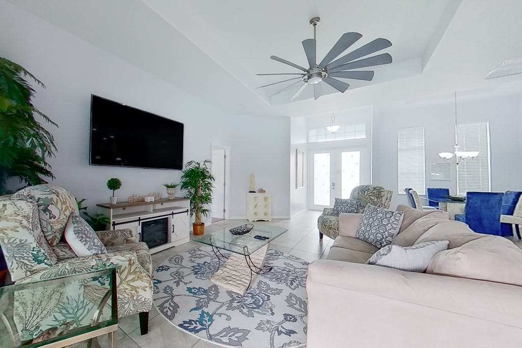 Waterfront home with private pool dock WiFi central AC & desk workspaces