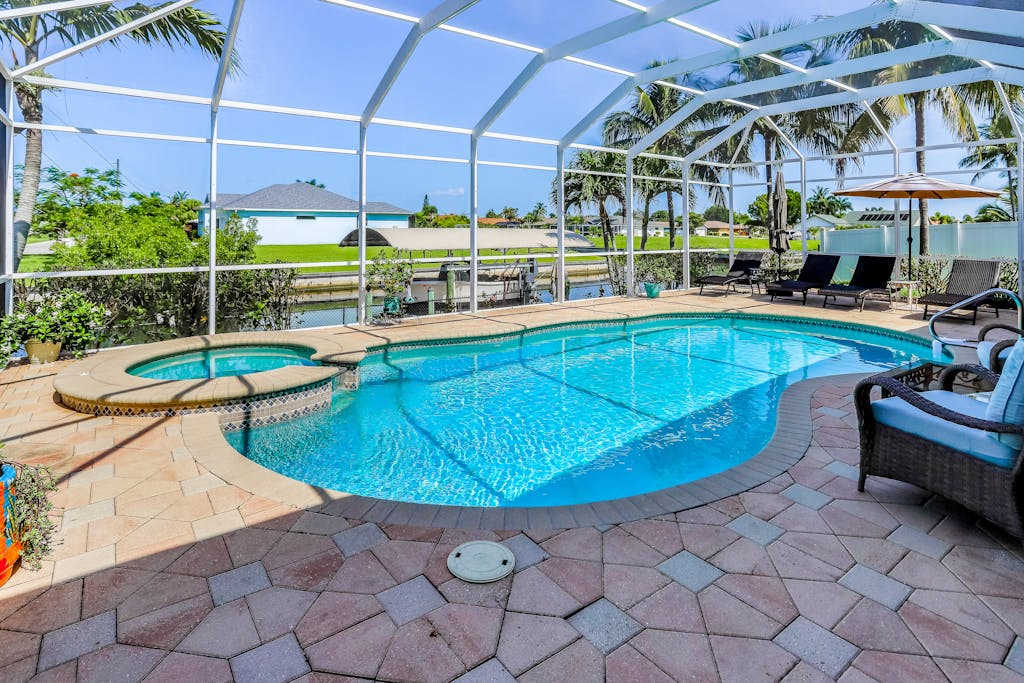 Dog friendly home on canal with heated pool spas central AC & washer & dryer