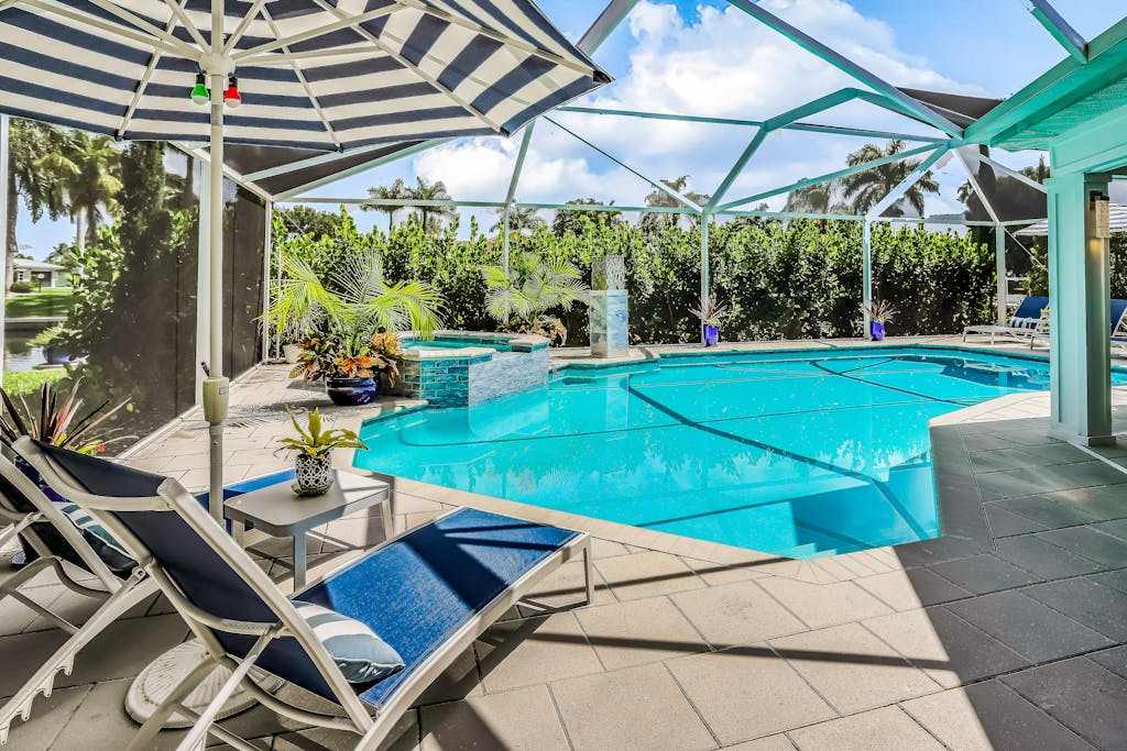 Waterfront escape in the heart of the action with pool spa grill & WiFi