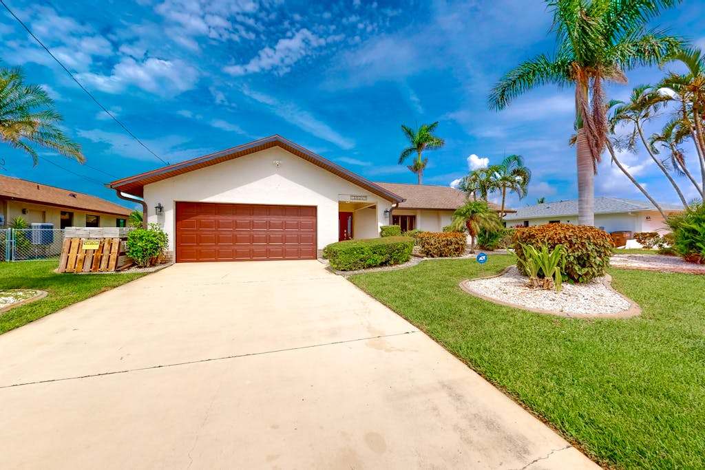 Coastal Cabana canal front home with private heated pool dock inviting patio