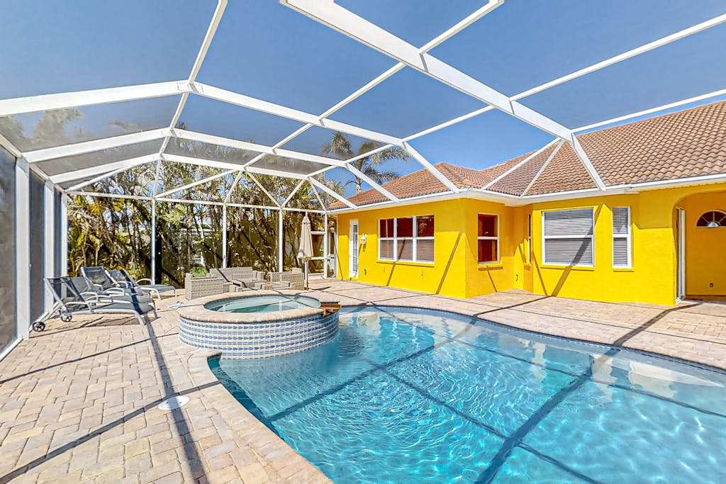 Canal front home with pool outdoor kitchen & private dock dog friendly