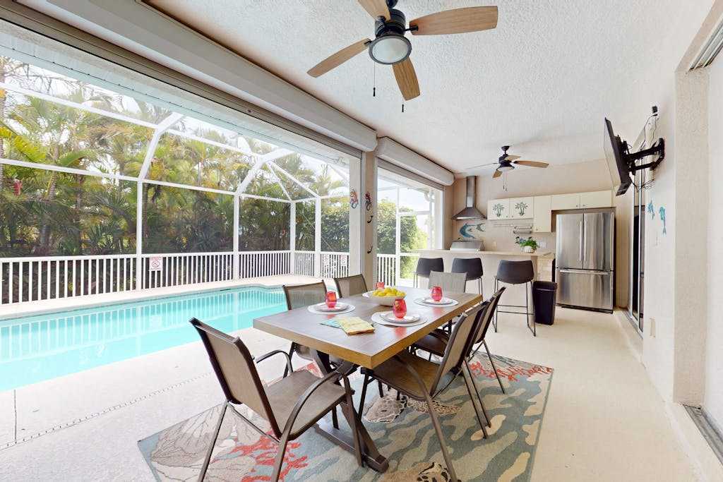 Canal home with solar warmed pool covered patio & grill dog friendly