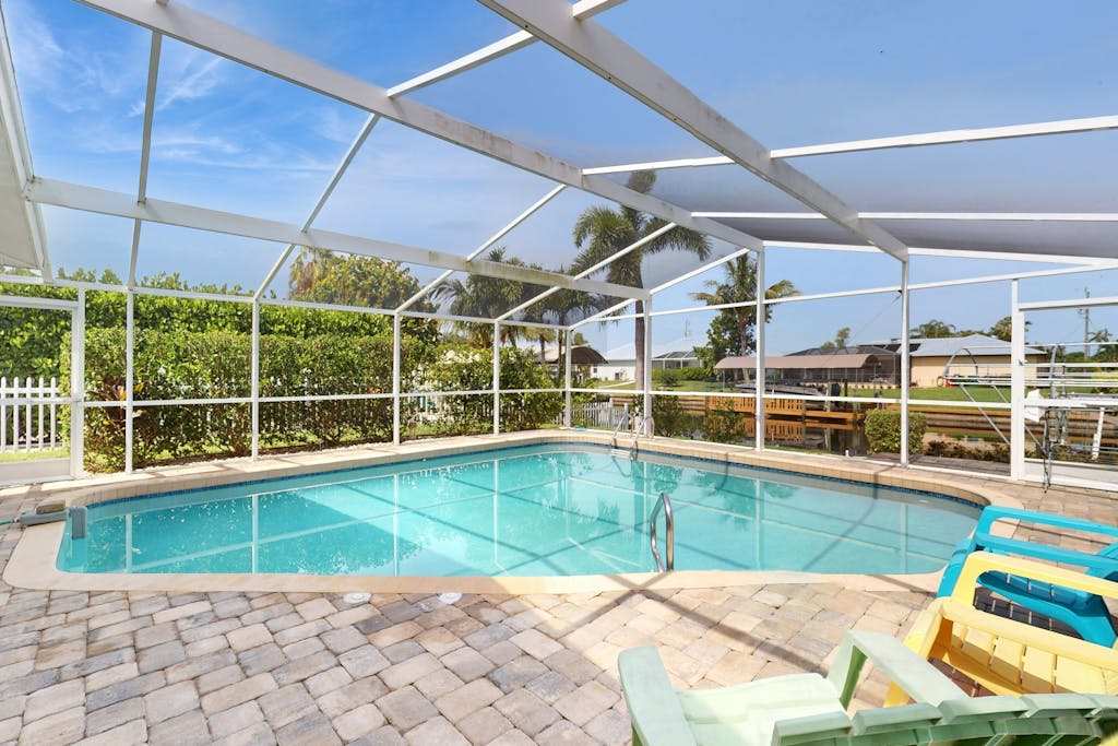 Canal front home with screened pool dock access patio grill AC & washer & dryer
