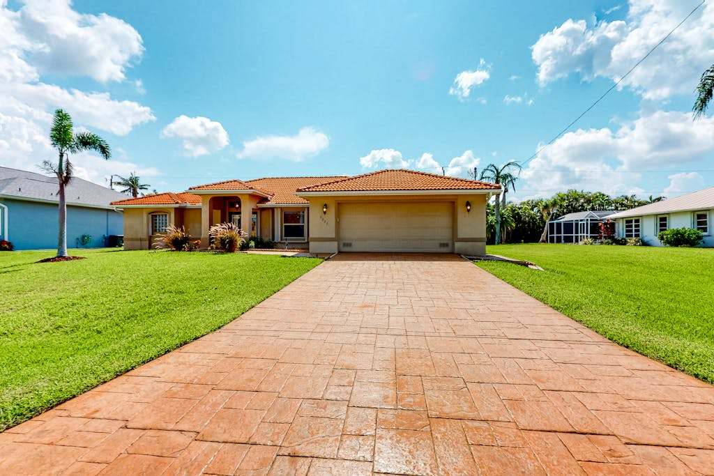 Inviting home with pool water view enclosed yard central AC washer & dryer