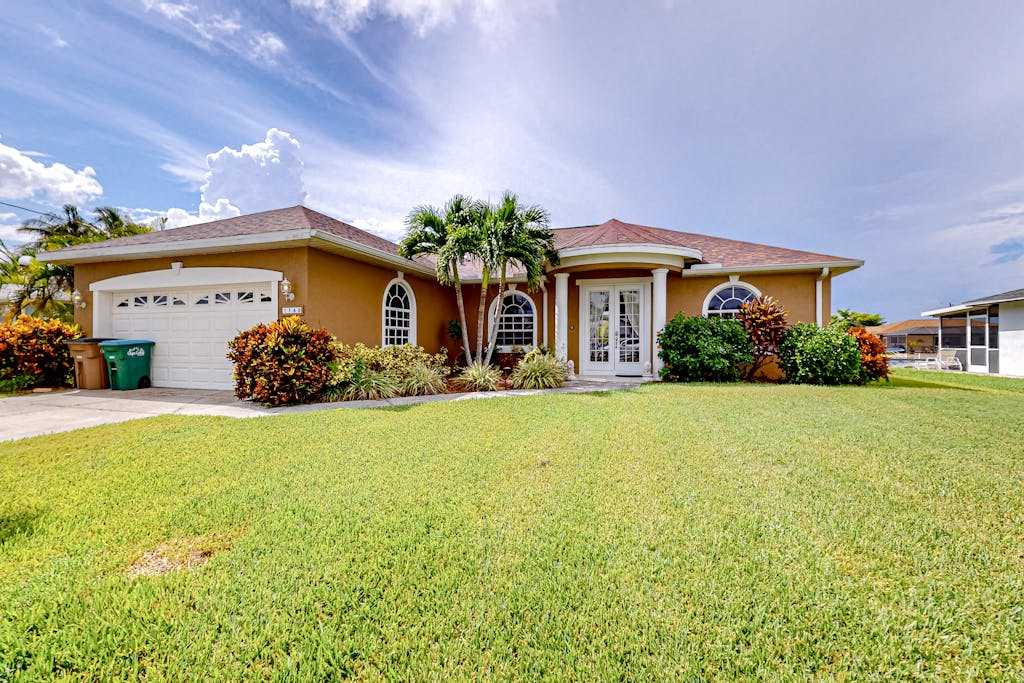 Waterfront home with screened pool patio grill foosball AC & washer & dryer