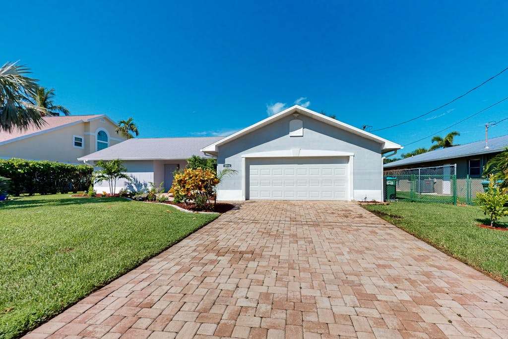 Canal front home with private heated pool dock river views patio grill & washer & dryer