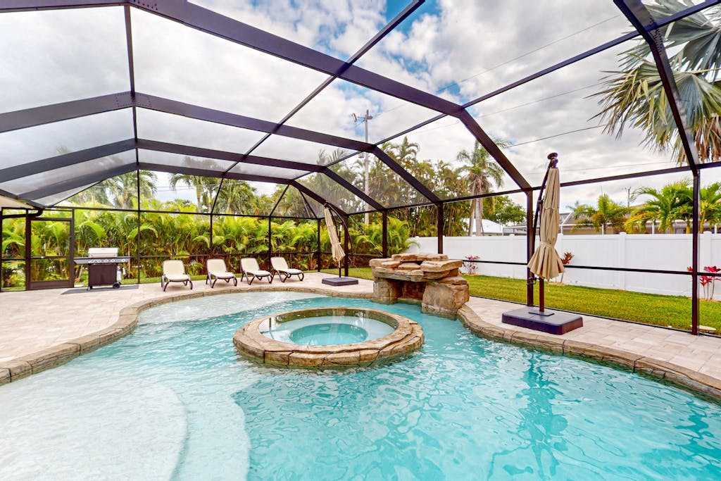 Chic pool home with designer heated saltwater poolattached spa covered patio