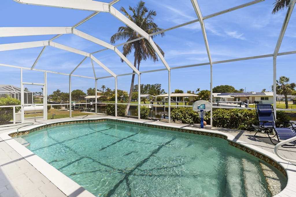 Beautiful home with private pool waterfront views & home theater