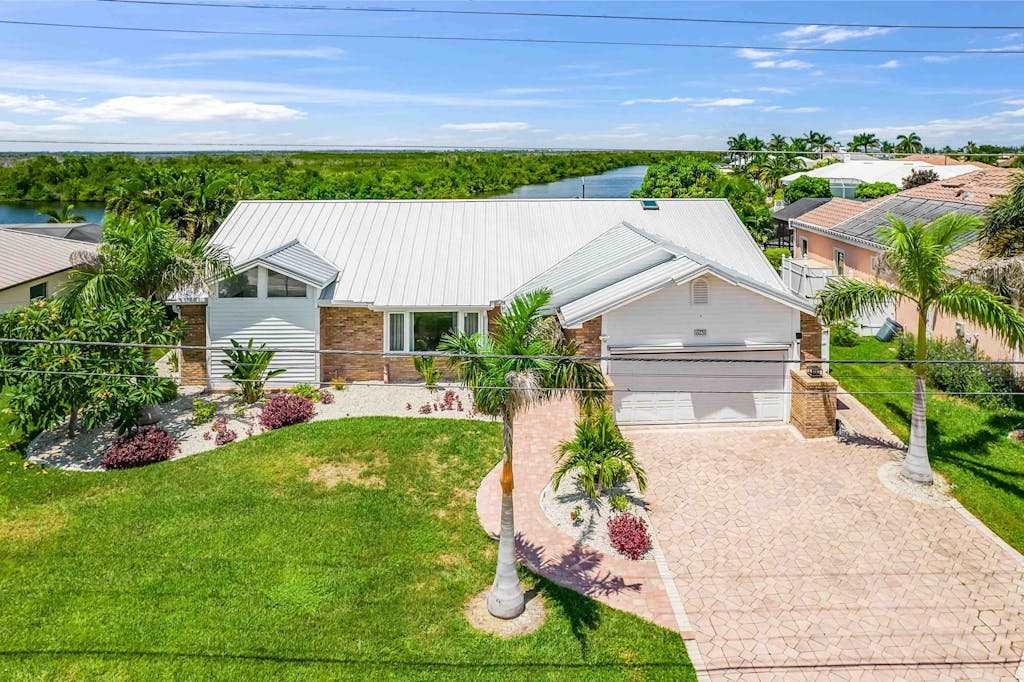Exquisite waterfront home with private pool hot tub amd dock