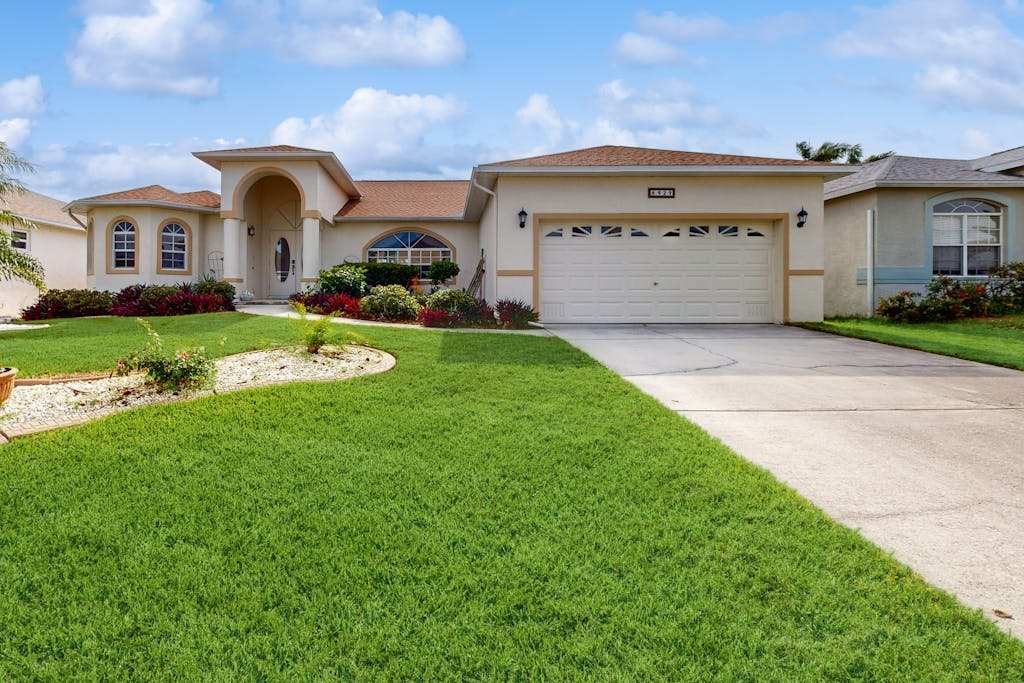 Spacious Lakefront Home with a Screened In Pool in Exclusive Community