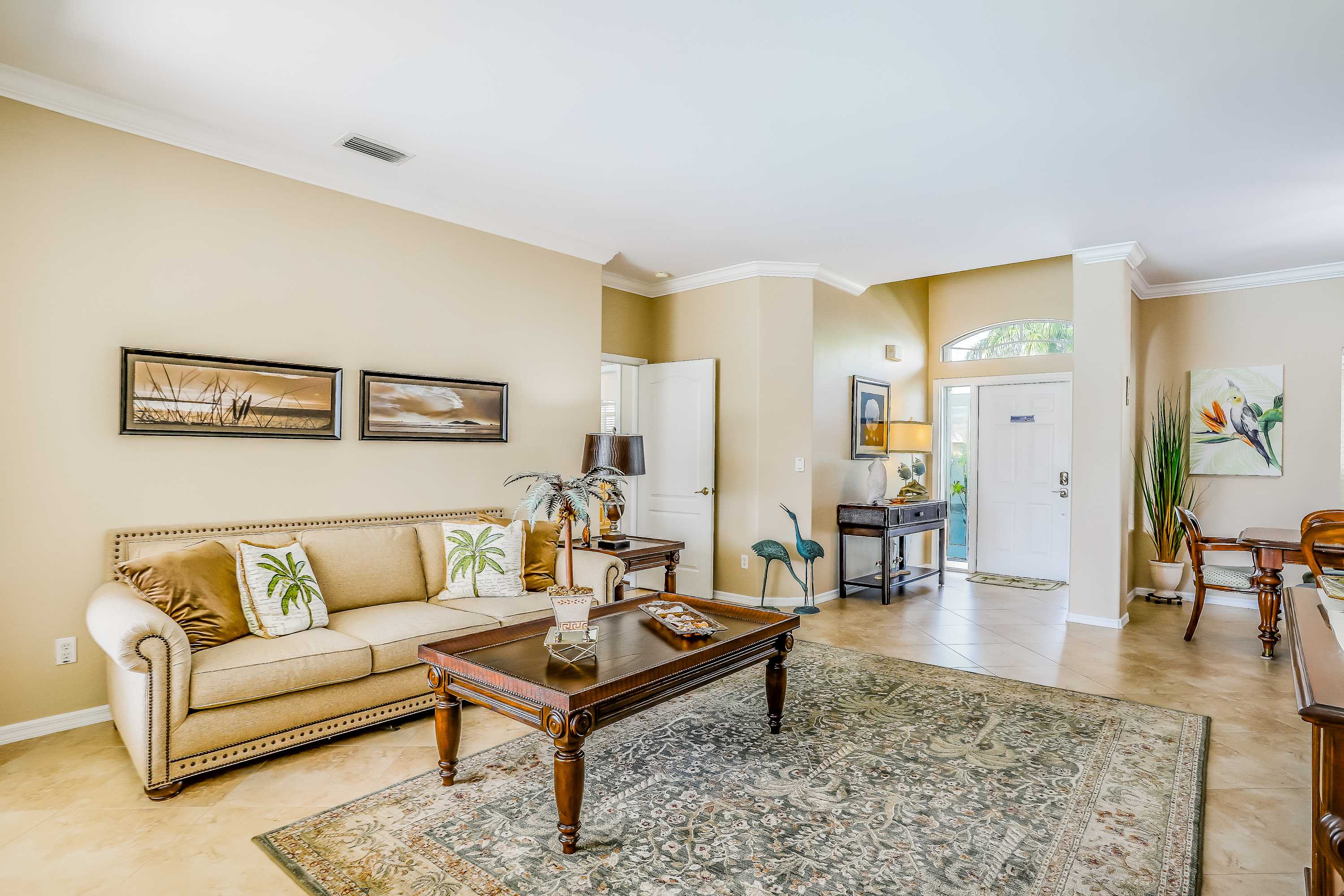 Spacious home with screened in pool & lush lakefront views minutes to beaches