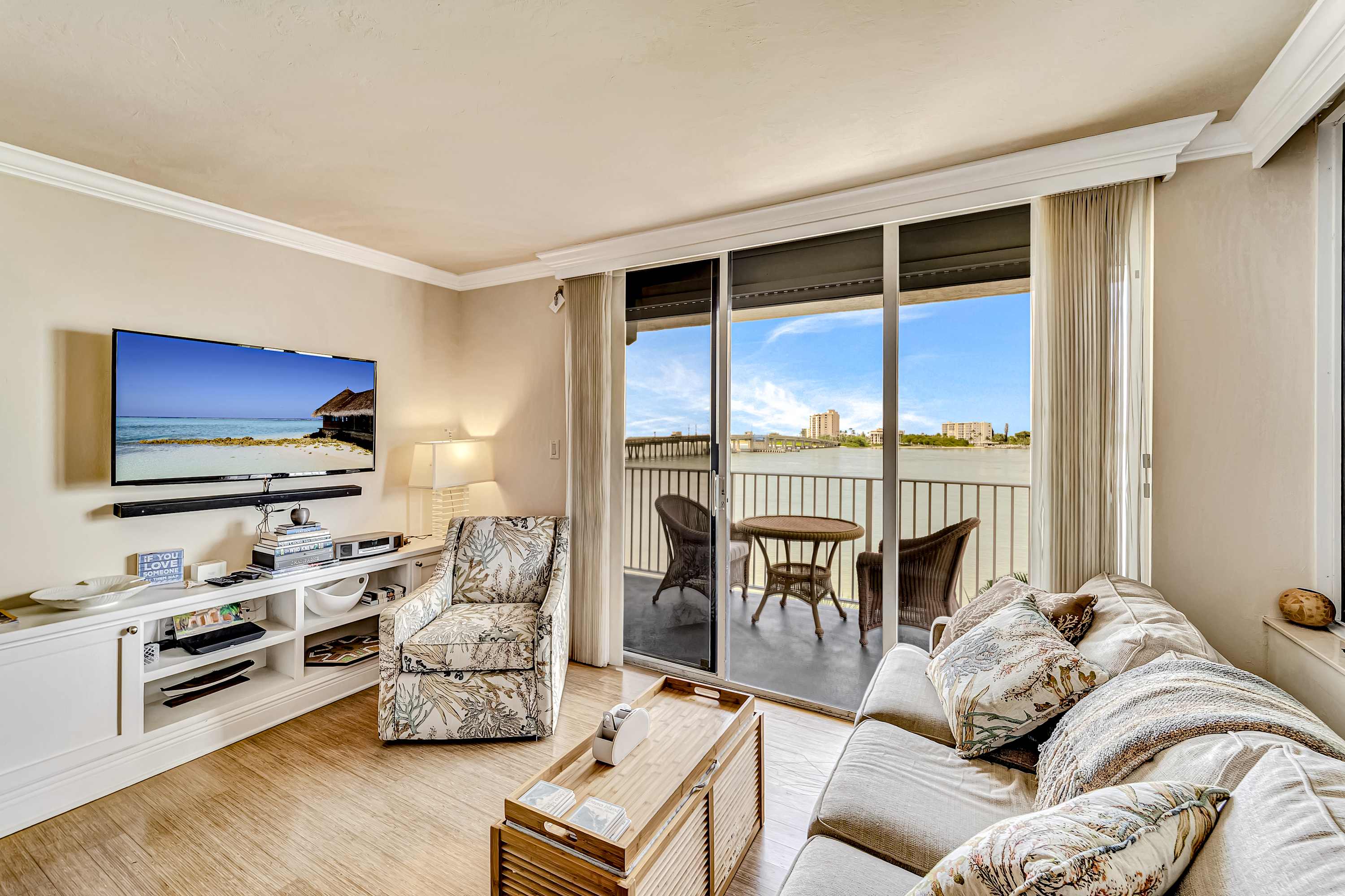 Waterfront condo with private beach area pool hot tub grills & balcony