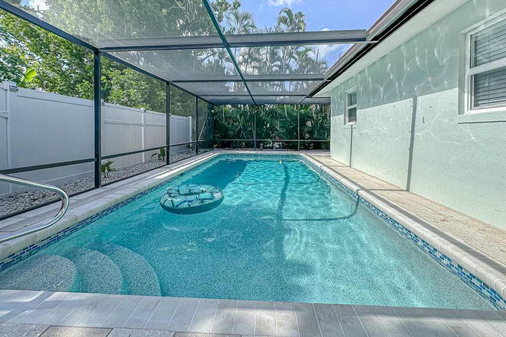 Bright & airy home with enclosed pool hammock & open concept interior