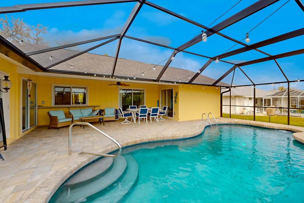 Renovated dog friendly home near beach with private pool screened lanai grill