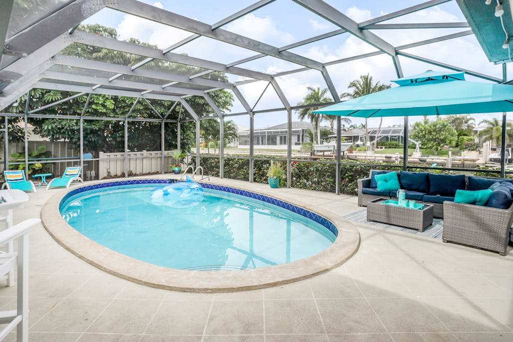 Canal front home with private pool & boat dock two miles to Tigertail Beach