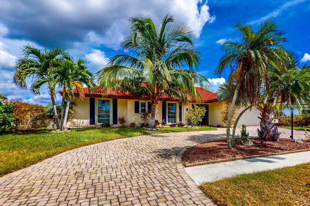 Waterfront Home with Private Dock & Enclosed Lanai Near Residence Beach