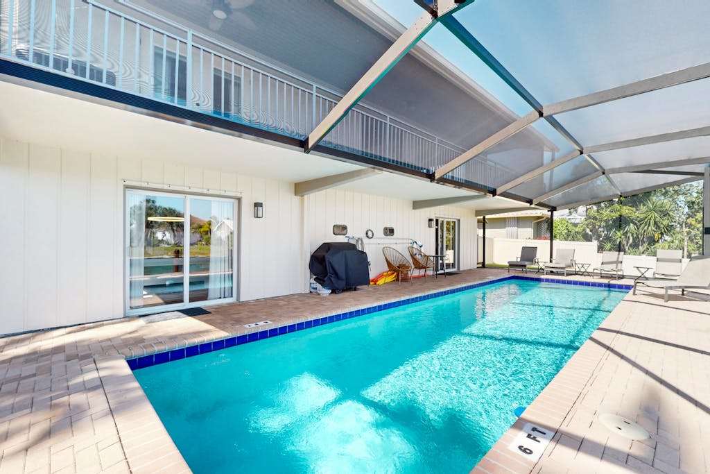 Snowbird friendly home with private pool enclosed lanai & putting green