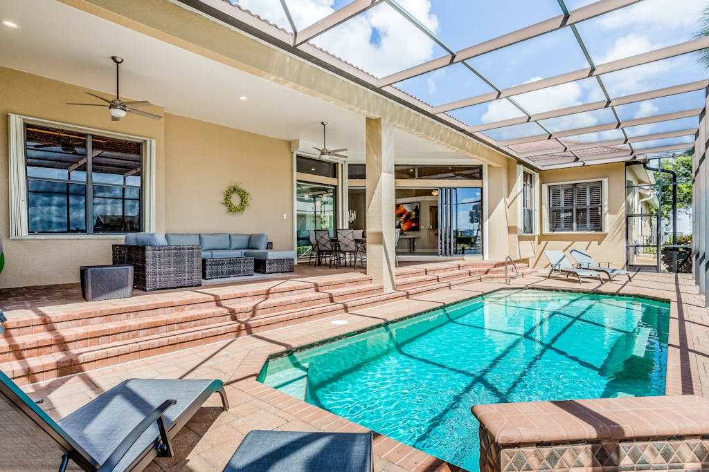 Canal front home with fast WiFi pool & lanai near beach