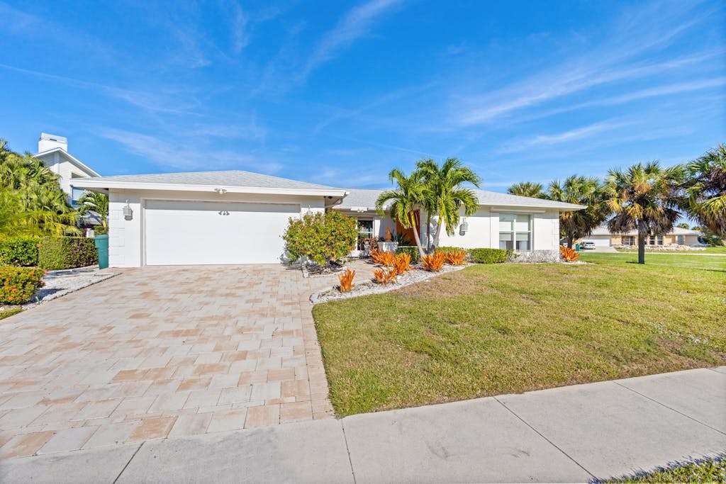 Snowbird friendly home near water with private heated pool grill patio & washer & dryer