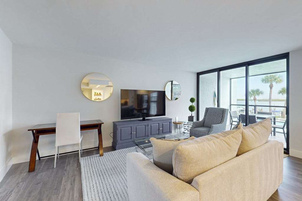 Luxury waterfront condo with shared pool hot tub & a tennis court