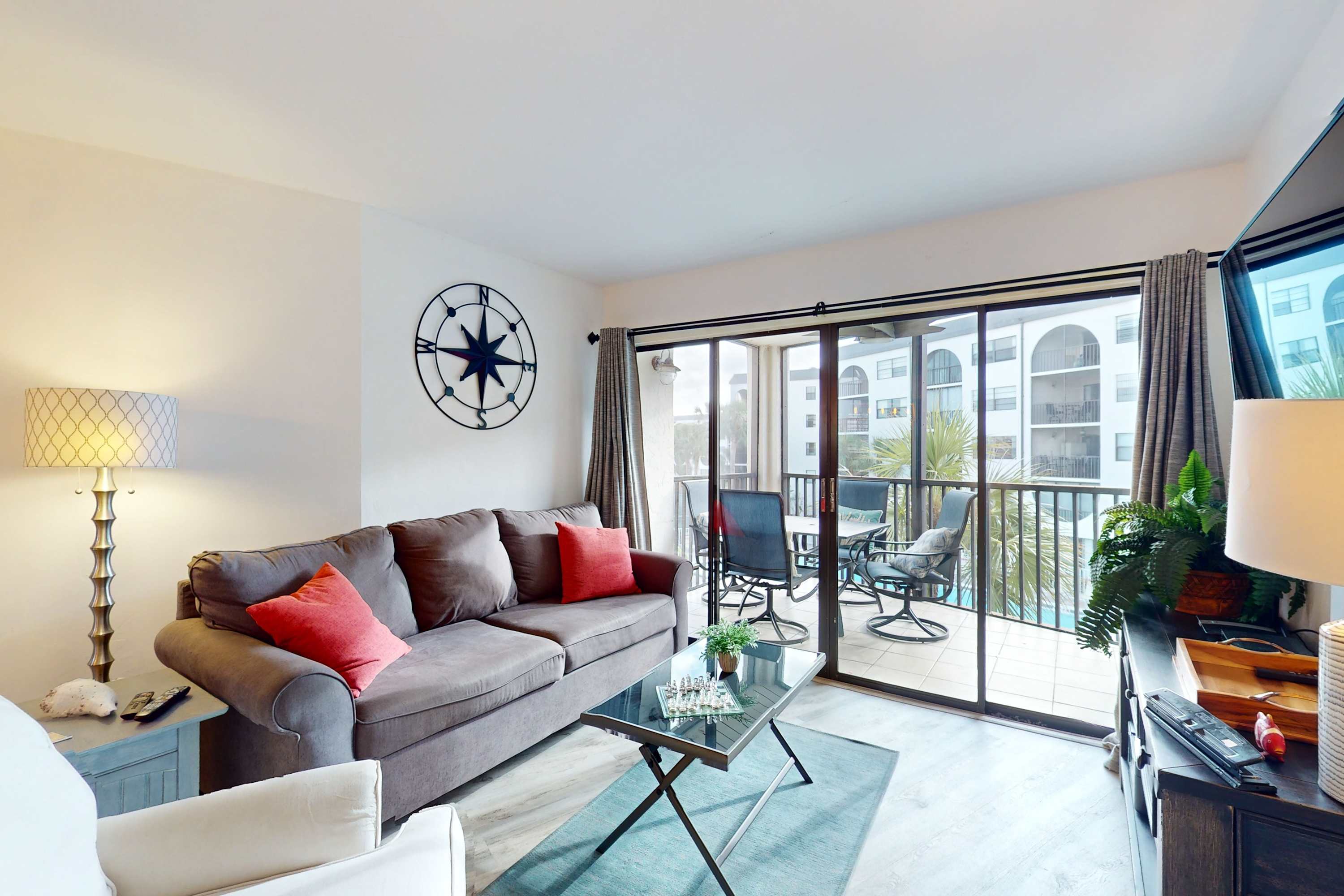 Charming waterfront condo with balcony views hot tub tennis courts & pool