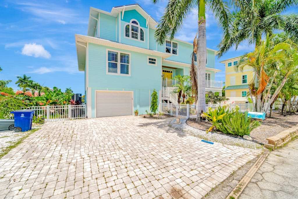 Waterfront home with private pool dock patio balconies & bikes
