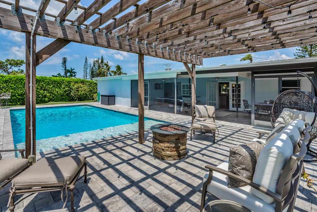 Inviting retreat with a large yard heated pool firepit games & modern charm