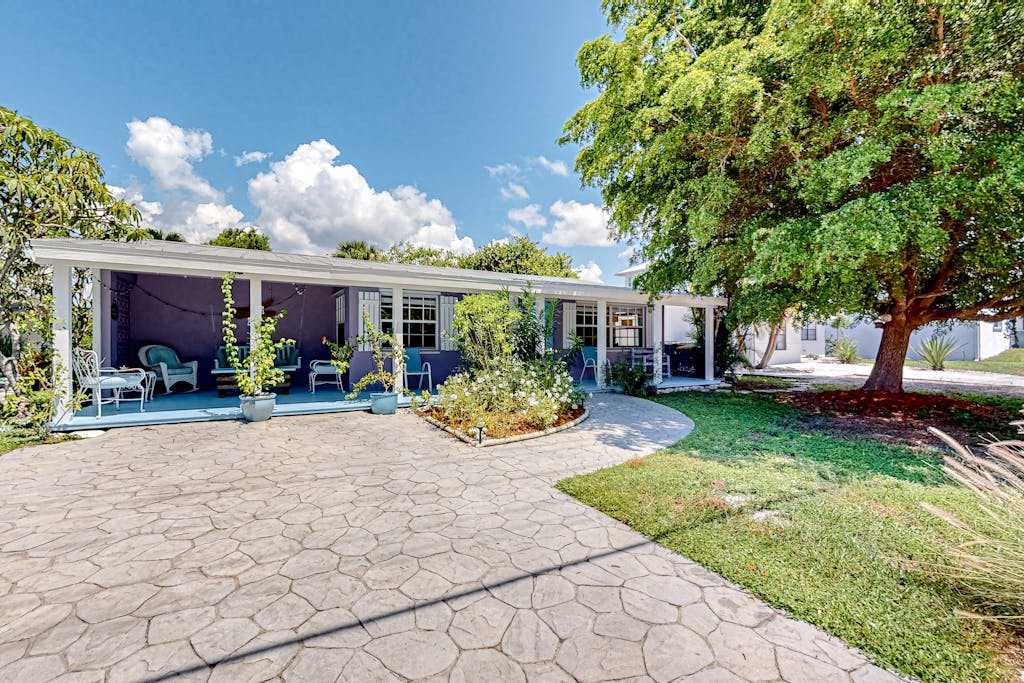 Enchanting dog friendly beach bungalow with patio fireplace deck AC & washer & dryer