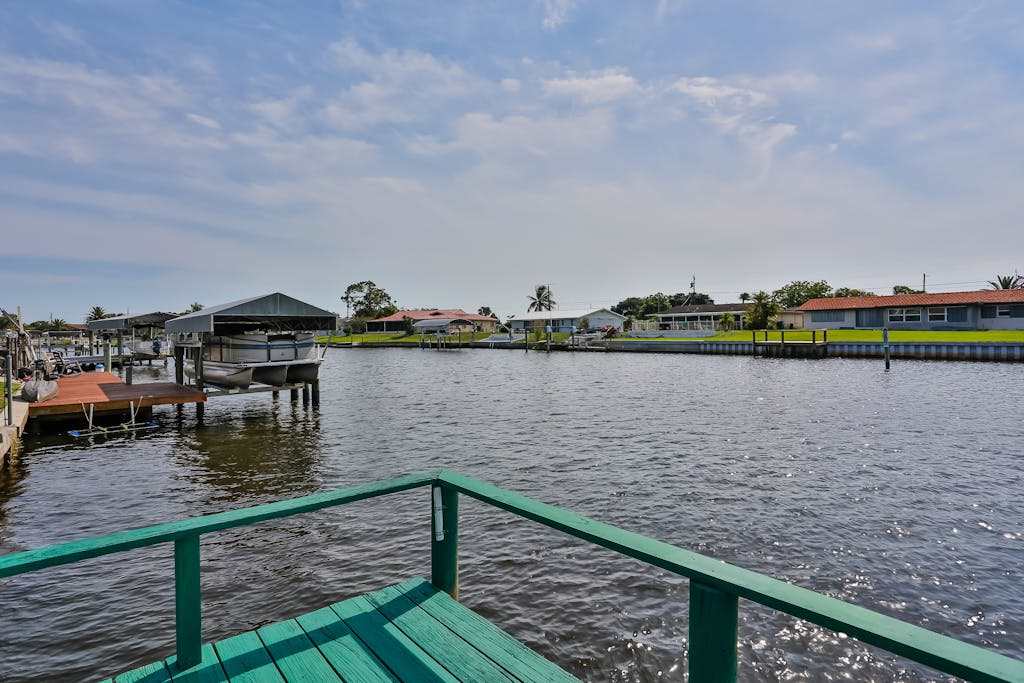 Relax Work or Play in this Retro Waterfront Home with Sunsets & Private Dock
