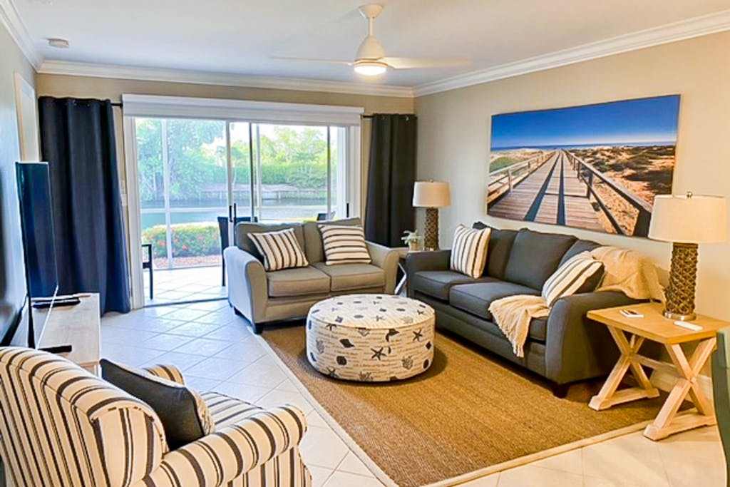 Lakefront getaway with walk out lanai pool tennis & Bocce courts & marina