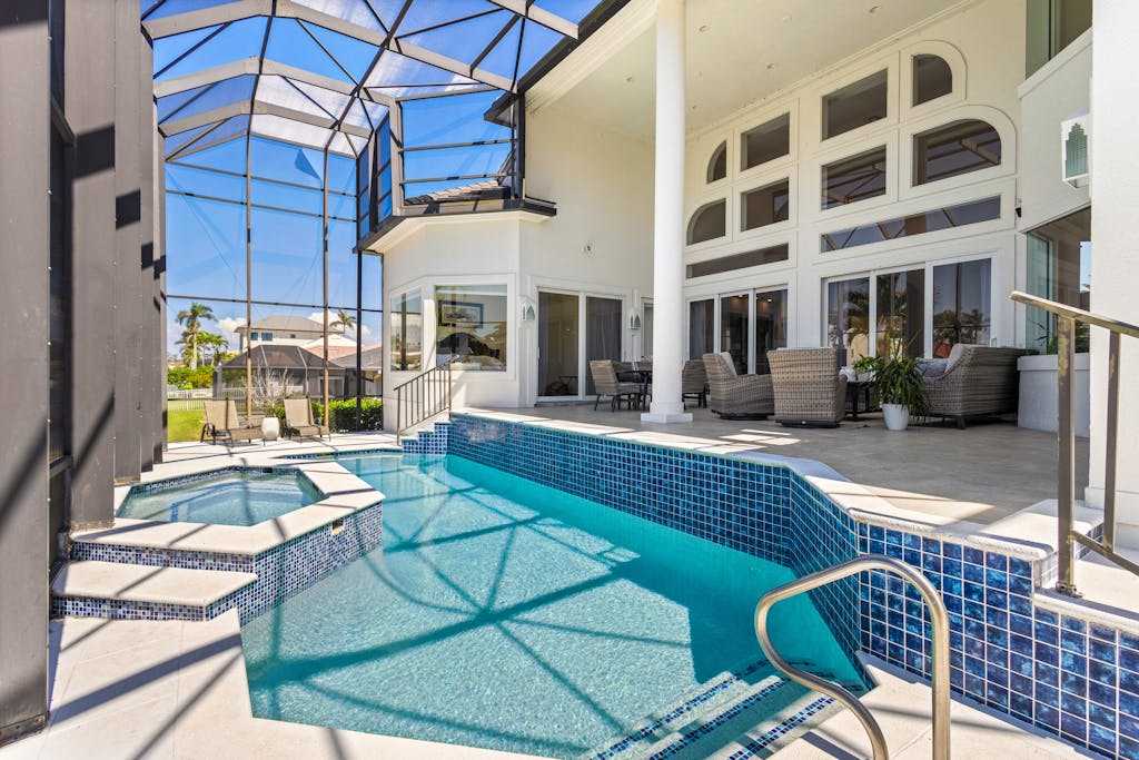 Exquisite waterfront home with lanai heated pool & spa-hot tub & internet