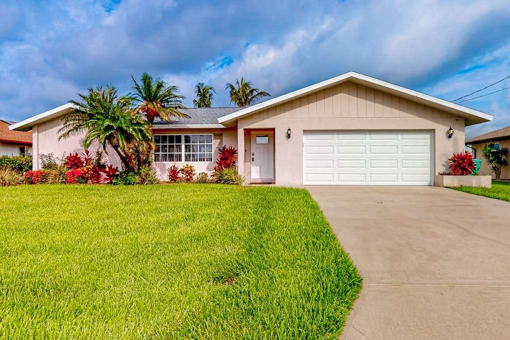 Waterfront home with an enclosed pool outdoor kitchen & grill dog friendly