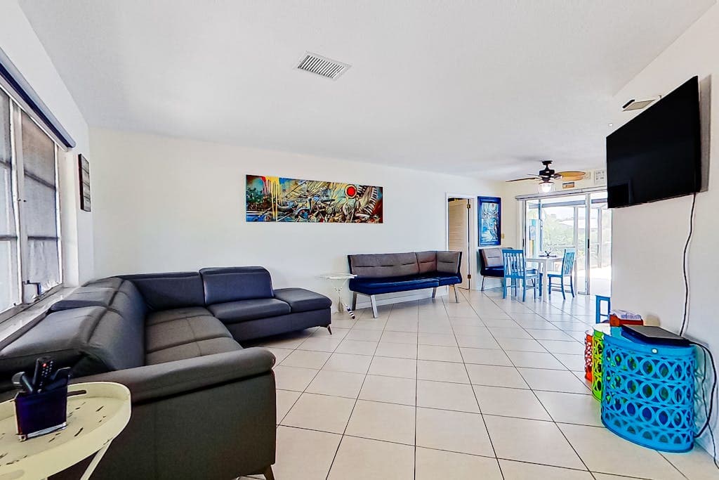 Private home on the canal with dock screened pool patio AC & washer & dryer dog friendly