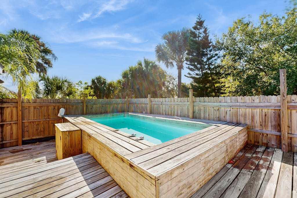 Gorgeous canal front home above ground pool & close to beach