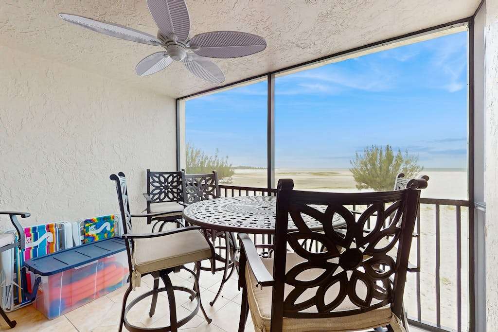 Beachfront condo with screened balcony community pool & internet