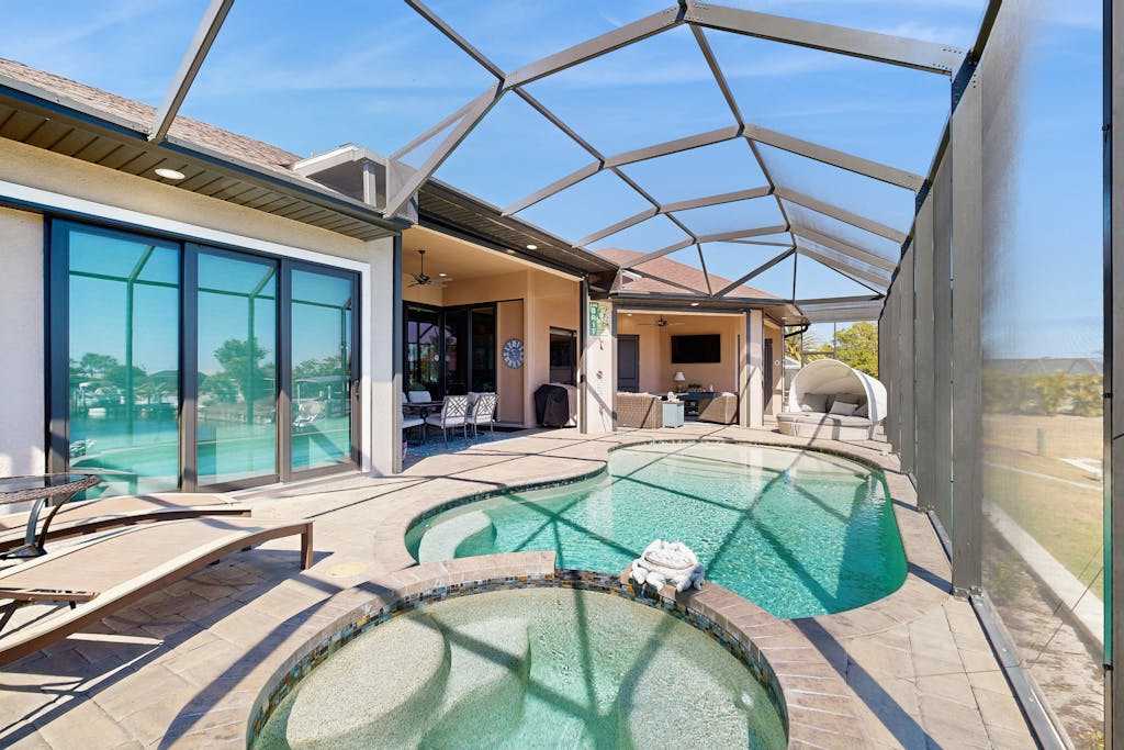 Ultimate waterside retreat with private dock lanai pool & spa BBQ & WiFi