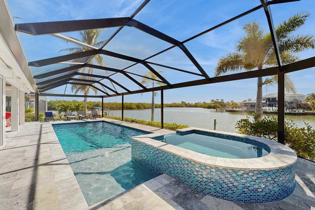 Spacious canal front home with private pool dock & close to everything