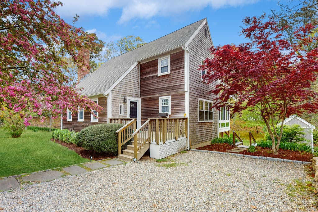Cheery house with deck, sunroom & patio - short walk to pond, beach & Rail Trail
