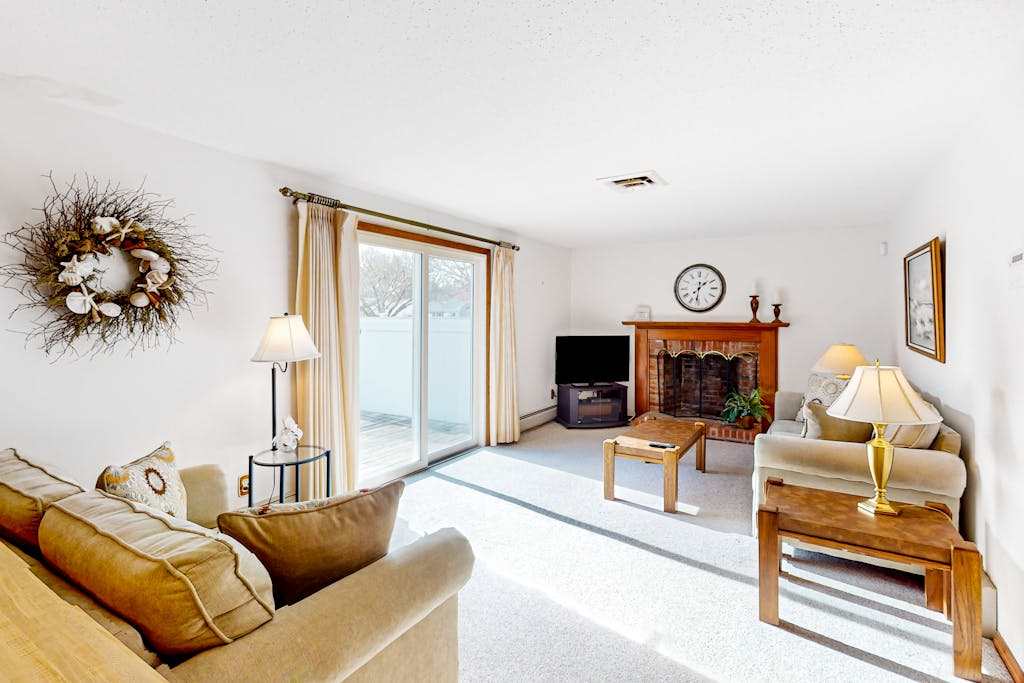 Single-story home with fenced yard, deck & great location near town & beaches